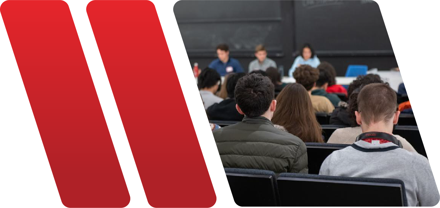 2 red slashes followed by a photo of students listening to a seminar.